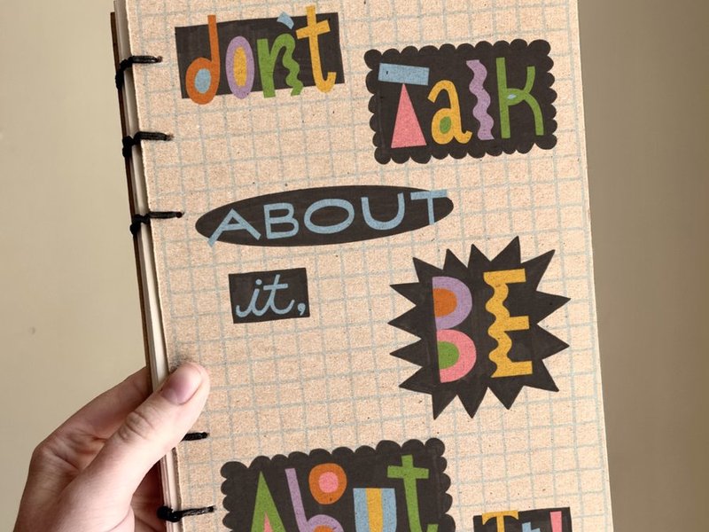 Hand-bound book with Don't Talk About It lettering